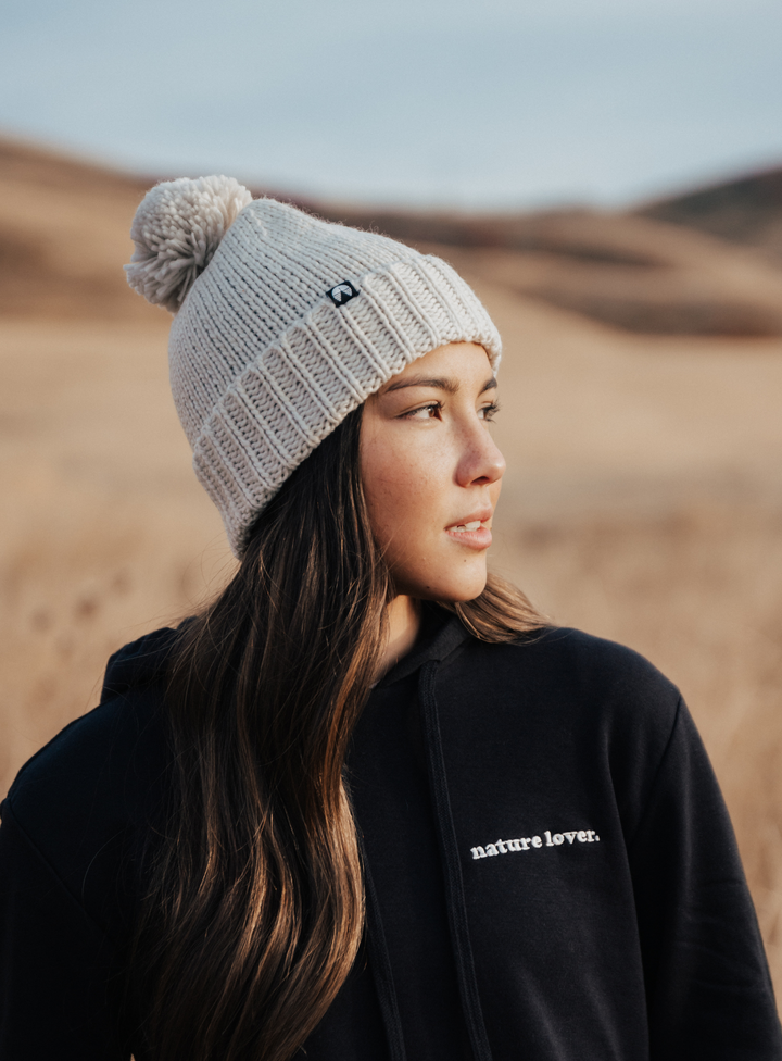 Creamy grey pom beanie by Indy Brand