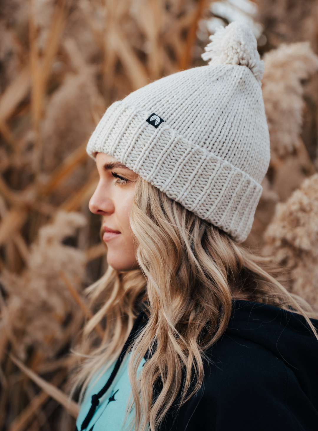 Creamy grey pom beanie by Indy Brand