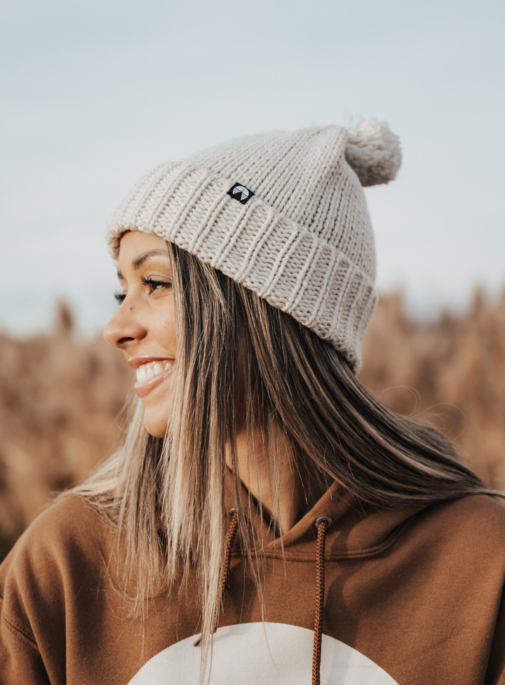 Creamy grey pom beanie by Indy Brand