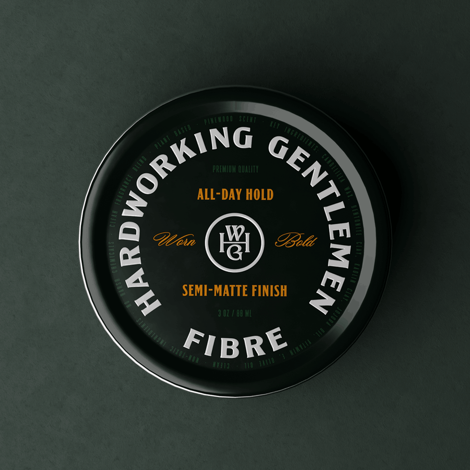 Container of Hardworking Gentlemen fibre product on a dark background