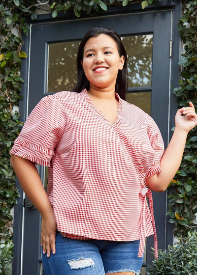 Plus Size Fringe Trim Gingham Wrap Blouse in Red Gingham by Shop at Konus