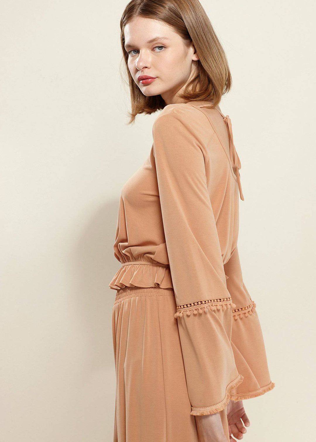 Women's Fringe Cuff Bell Sleeve Top in Apricot by Shop at Konus